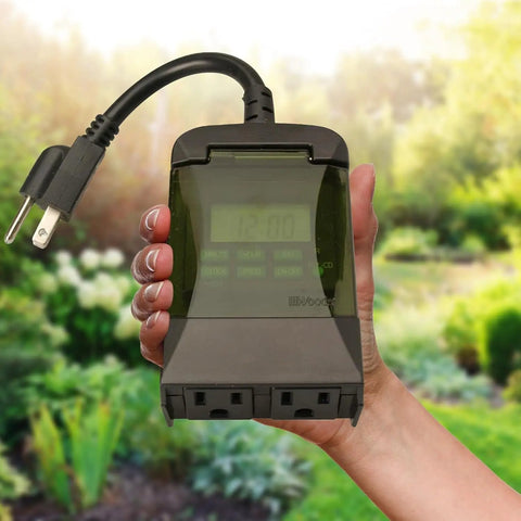 Weatherproof Seven Day Outdoor Digital Plug In Timer Featuring Dual Grounded Outlets And No Sweat Programming for easy outdoor energy management.