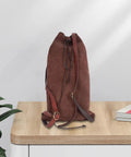 Medieval Style Backpack For Travel And Outdoor Adventures With Adjustable Straps Your Go To Rucksack For Men And Women Great For Hiking Camping Cosplay Daily Use Coffee Color 28x45 cm, displayed on a wooden table.