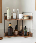 Super Sleek 2 Tier Wooden Corner Shelf For Bathroom Counter And Vanity with skincare products neatly organized on wooden shelves.