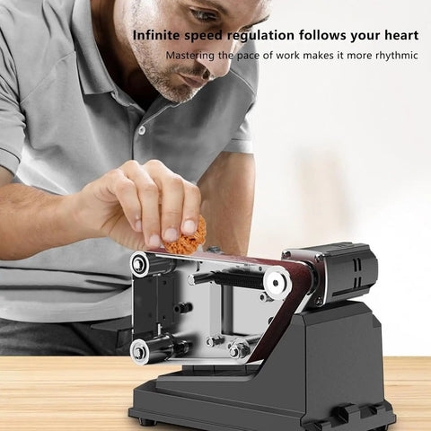Person using Built Tough Mini Belt Sander And Bench Grinder With A Beefy 180W Motor for precise wood finishing.
