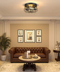 Two Light Industrial Farmhouse Ceiling Light With Dope Black Metal Cage in a living room setting