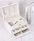 36 Pack Mini Round Knobs With An Upscale Bronze Touch Forged From Tough Zinc Alloy on white jewelry box with drawers.