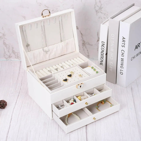 36 Pack Mini Round Knobs With An Upscale Bronze Touch Forged From Tough Zinc Alloy on white jewelry box with drawers.