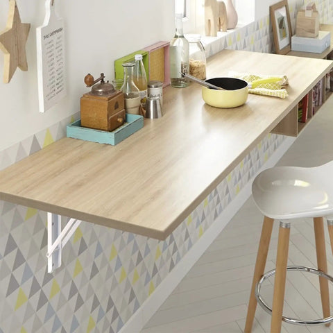 Wall-mounted table supported by White Folding Shelf Brackets 20 Inch Heavy Duty L Shaped DIY Collapsible Shelf Brackets For Workbench.