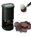 Heavy Duty Electric Coffee Tamper 58mm With Adjustable Pressure And Non Stick Build showing a black tamper with ground coffee.