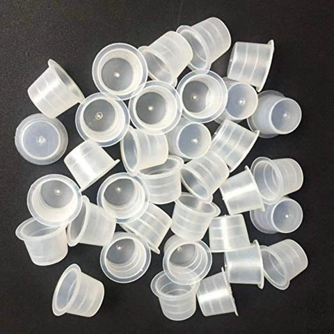 Large Tattoo Ink Cups 500 Pack Plastic Pigment Cups Size 15 Disposable Microblading Cups scattered on black surface