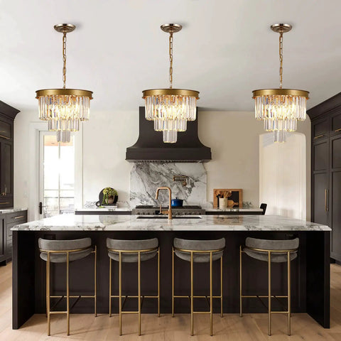 Gold Crystal Chandelier 16 Inch Modern Ceiling Pendant Light Fixture Dimmable Flush Mount Round Chandelier For Dining Room Kitchen Island Foyer Entryway Living Room Totally Chic Glam Glow shown above a kitchen island.