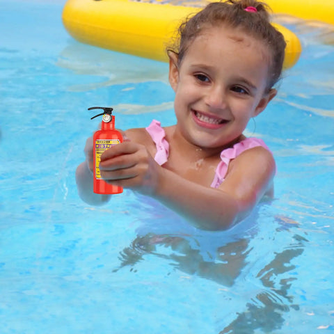 Girl in pool holding a red mini fire extinguisher water squirt gun, part of a twelve piece set for kids summer fun.