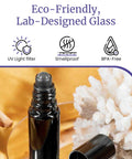 Black Ultraviolet Glass Roller Bottle 15 Ml Essential Oil Bottle With Glass Ball Roll On Tip and open screw cap on gold fabric