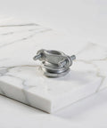 Heavy Duty Conduit Cable Clamps With An Ironclad Grip For No Sweat Electrical Runs Top Shelf High Strength Alloy and Quick Finger Fitment isolated on marble.