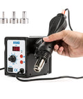 Hand holding heat gun of 2 In 1 SMD Soldering Iron And Hot Air Rework Station With LED Display 110V, 898D Kit, showing LED panel and nozzles.