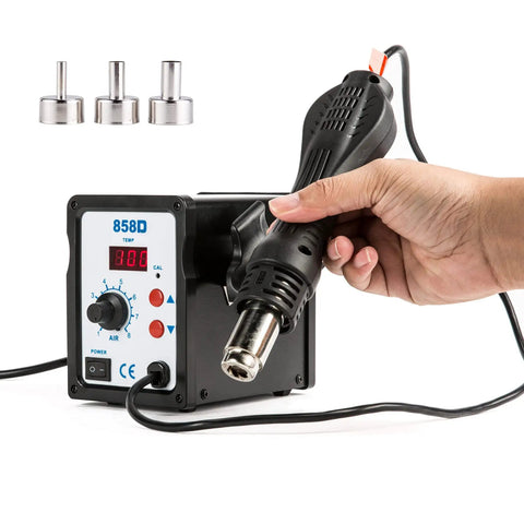 Hand holding heat gun of 2 In 1 SMD Soldering Iron And Hot Air Rework Station With LED Display 110V, 898D Kit, showing LED panel and nozzles.
