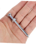 Silver metal spike for Heavy Duty Lawn Aerator Shoes With Metal Spikes For Deep Soil Aeration And Lawn Health held in hand