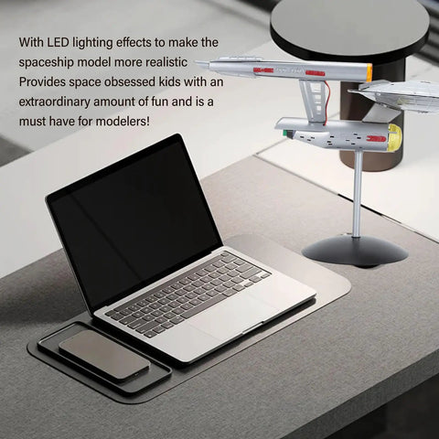Lit LED Spaceship Model Kit For Display In One Thousandth Scale Lifelike Spaceship Ornament on desktop next to laptop