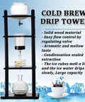 Slick Cold Drip Coffee Maker Draws Top Shelf Flavor Via A Smooth Slow Drip Vertical Cold Brew Tower with glass and wood design.