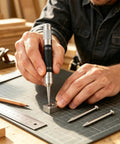 Kickass Five Inch Automatic Center Punch With Heavy Duty Rustproof Steel Body Adjustable Spring Tension And Two Extra Bits For Hella Precise Marking On Iron Or Wood In Your Project, marking a metal block.