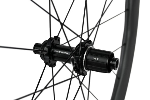 Close-up hub of Carbon Fiber Wheelset For Road Bikes 700c Disc Brake Tubeless 50 By 28mm UD Matte Black Decals Ultralight And Ultra Strong