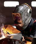 Welder using Pro Grade Graphic Auto Darkening Welding Helmet With Digital ADF, ANSI Z87.1 Certified, ultra lightweight design