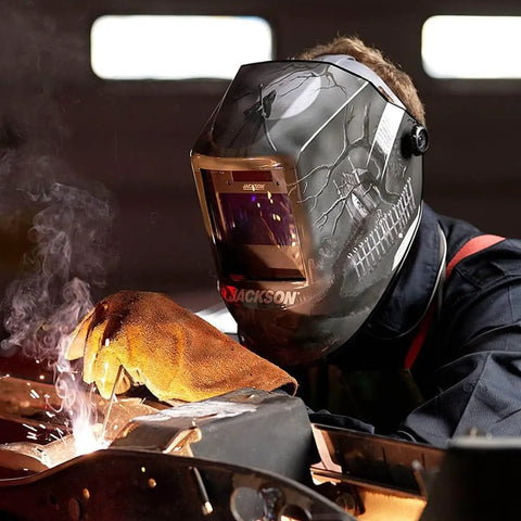 Welder using Pro Grade Graphic Auto Darkening Welding Helmet With Digital ADF, ANSI Z87.1 Certified, ultra lightweight design