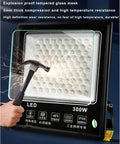 JUDYSSY 6500K Led Floodlight Outdoor with explosion-proof tempered glass, 300W, demonstrating durability against impact.