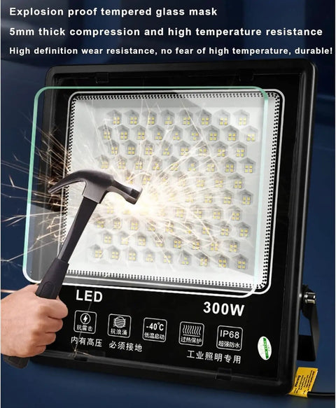 JUDYSSY 6500K Led Floodlight Outdoor with explosion-proof tempered glass, 300W, demonstrating durability against impact.