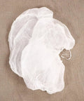 10 Pcs Disposable Nonwoven Bouffant Hair Caps With Straight Comfort Elastic Fit For Full Head And Face Shield on brown fabric.