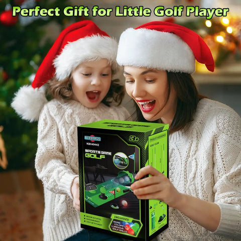 A woman and child with Santa hats smiling next to an Upgraded Kids Golf Set With Dinosaur Automatic Returner Light Up Night Golf Balls 3 Clubs Putting Mat Ages 3 To 8 Mini Golf Game Kit for Indoor And Outdoor Play Fun Educational Sports Toy For Boys And Girls box.
