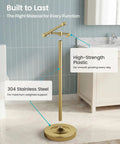 Heavy Duty Freestanding Toilet Paper Holder Stand In Matte Gold Frame showing high-strength plastic and weighted base.