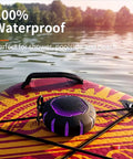 Waterproof Shower Bluetooth Speaker With IPX7 Rating on a paddleboard, showcasing its ultra portable carabiner clip and LED lights.