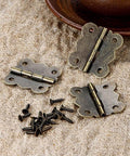 40 Pieces Antique Bronze Butterfly Hinges For Tiny Jewelry Boxes, Dollhouse Cabinets, And Miniature Woodworking Projects, 20 By 17 Mm Iron Hinges With Rust Resistant Plating And Included Screws shown on burlap surface.