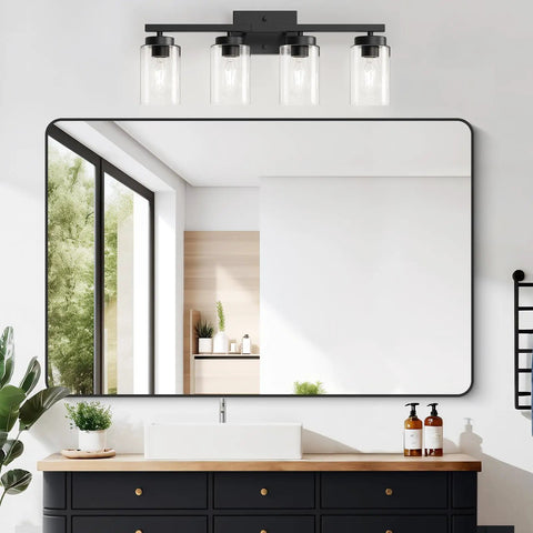Top Shelf Four Light Bathroom Vanity Fixture With Slick Matte Black Frame And Knockout Clear Glass Shades over sink, modern home decor.
