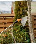 Two Pack Transparent Windproof Spray Nozzle Covers for garden hose attached to sprayer, clear shield in garden setting