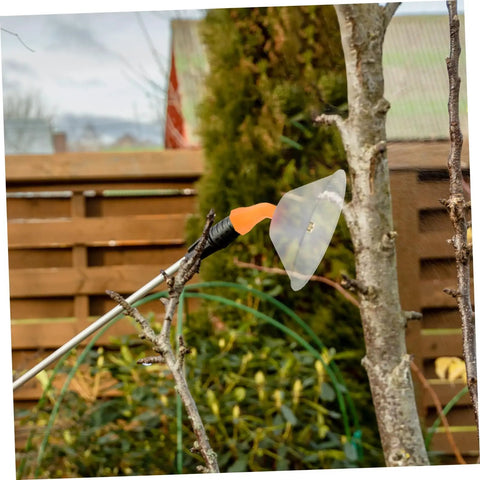 Two Pack Transparent Windproof Spray Nozzle Covers for garden hose attached to sprayer, clear shield in garden setting