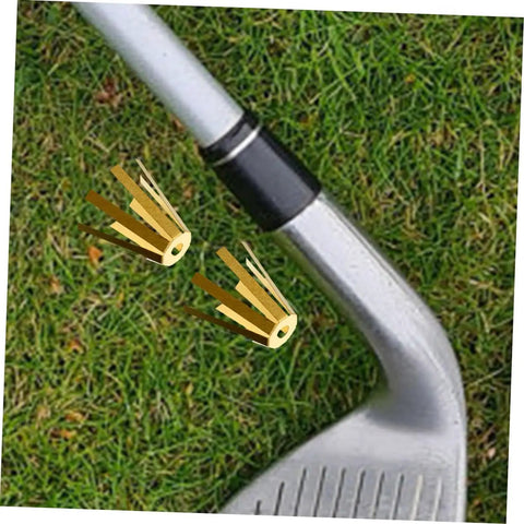 Set Of Five Premium Brass Golf Shaft Adapter Shims And Universal Shaft Spacers For Adjustable Iron Wedge Extensions Clubhouse Essential Upgrade Gear shown next to an iron club.