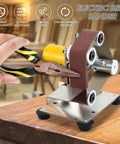Compact Mini Belt Sander Pack A Punch With Quick Adjust Speed Dial Multifunctional Electric Polisher And Corner Grinder Comes Ready With Extra Abrasive Strips Plus Buffing Pad For Knocking Out Trades in use with pliers on wooden surface.