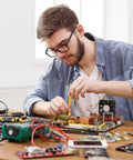 Man using Two Piece Multitool Pen Set For Everyday Carry With Nine In One Steel Pen And Six In One Aluminum Pen on electronics