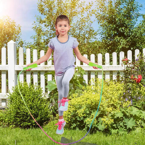 Girl playing with Rainbow Jump Rope Set For Kids, 10 Durable Nylon Skipping Ropes, in garden setting, 7.2 feet each