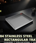 Hella Sturdy 304 Stainless Steel Drip Pan For AC Unit And Water Heater Condensate Catcher Keeps Your Space Bone Dry And Zero Hassle Cleanup Totally Rust Proof Flat Bottom Utility Tray on a dark table.