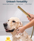 A hand uses the GRANDJOY 23" LED Shower System with Handheld Spray, Brushed Gold to wash a golden retriever.