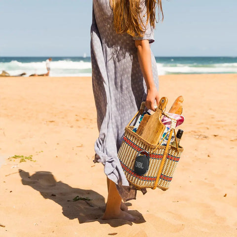 Woman on beach with Clip 4 Portable Mini Bluetooth Speaker with Carabiner IP67 Waterproof and Dustproof Design in woven bag