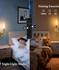 Set Of Two Rechargeable Battery Operated Wall Sconces Featuring Gold Glass Shades illuminating a bedroom with kids sleeping.