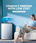 Straight Up Awesome 3.2 Cubic Foot Upright Freezer With Lightning Fast Cooling And Ridiculously Slim Build For Tiny Kitchens And Keeping Your Food Stash Totally Fresh next to woman using tablet.