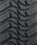 Close-up tread of Mud Terrain Light Truck Tire LT315 75R16 E Rated 127 124S with Aggressive Sidewall Design for traction.