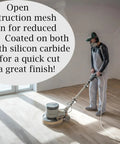 Worker using Silicon Carbide 60 Grit Screen Sanding Discs, 17 Inch, Two-Sided Mesh Discs, 10-Pack for Floor Refinishing in a room.
