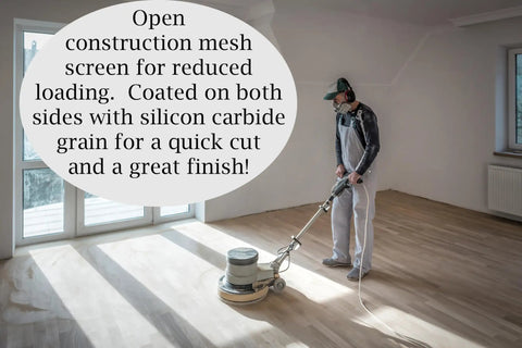 Worker using Silicon Carbide 60 Grit Screen Sanding Discs, 17 Inch, Two-Sided Mesh Discs, 10-Pack for Floor Refinishing in a room.