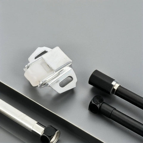 Mailbox Roller Catch Kit For Cabinet Doors And Drawers with iron construction and screws on a gray surface
