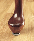 Wooden furniture leg fitted with One Sixteenth Inch Round Screw In Leveling Glides For Wood Furniture Adjustable Heavy Duty