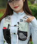Hydration Vest With Reflective 5L Waterproof Water Backpack, lightweight quick-dry breathable, woman showing no-fuss pockets.