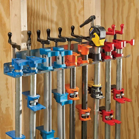 Heavy Duty Wall Mounted Pipe Clamp Rack That Keeps Clamps In Line Built From Galvanized Steel Holds Nine Pipe And Bar Clamps Up To 0.30 Inches Wide Organizes Your Workshop And Frees Up Space Like A Boss, pictured with clamps mounted.