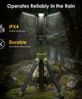 Rechargeable Camping Lantern With 9000mAh Battery, Adjustable Light Modes, IPX4 Water Resistant on tripod in rainy forest.